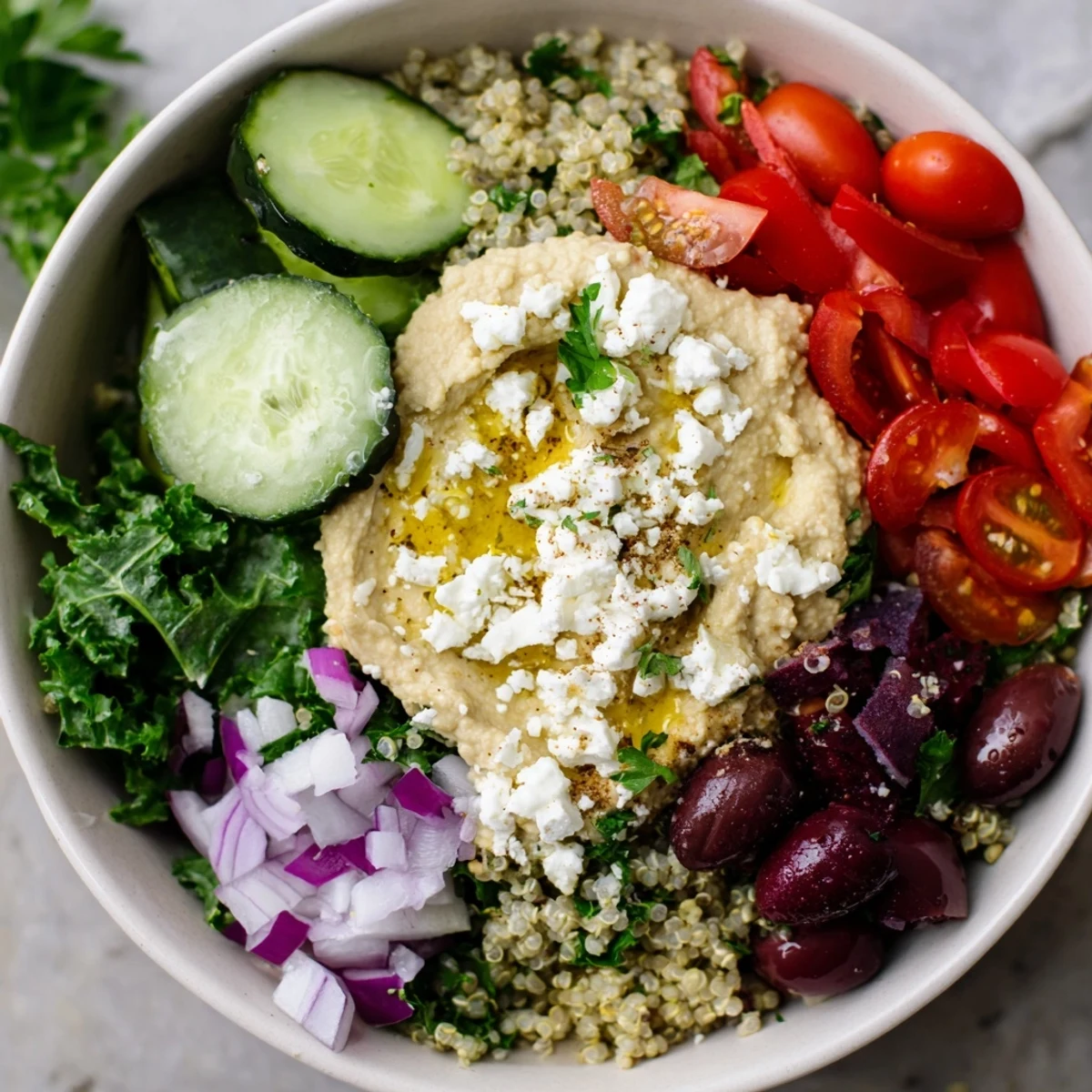 Deconstructed Mediterranean Hummus Bowl with warm pita wedges, red onion, and sumac spices.
