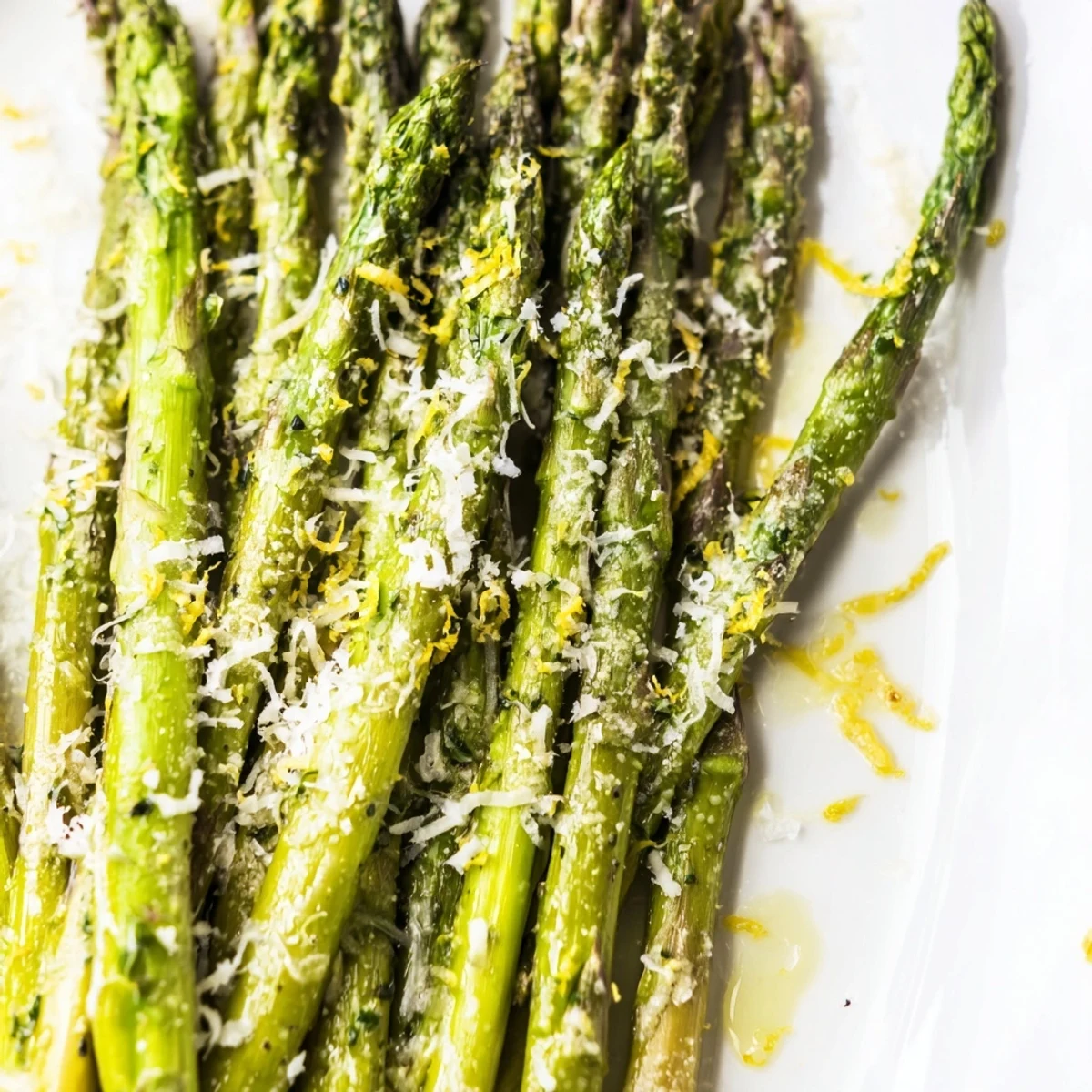 Golden brown asparagus with nutty Parmesan and a drizzle of lemon juice, ready to be enjoyed as an easy side.