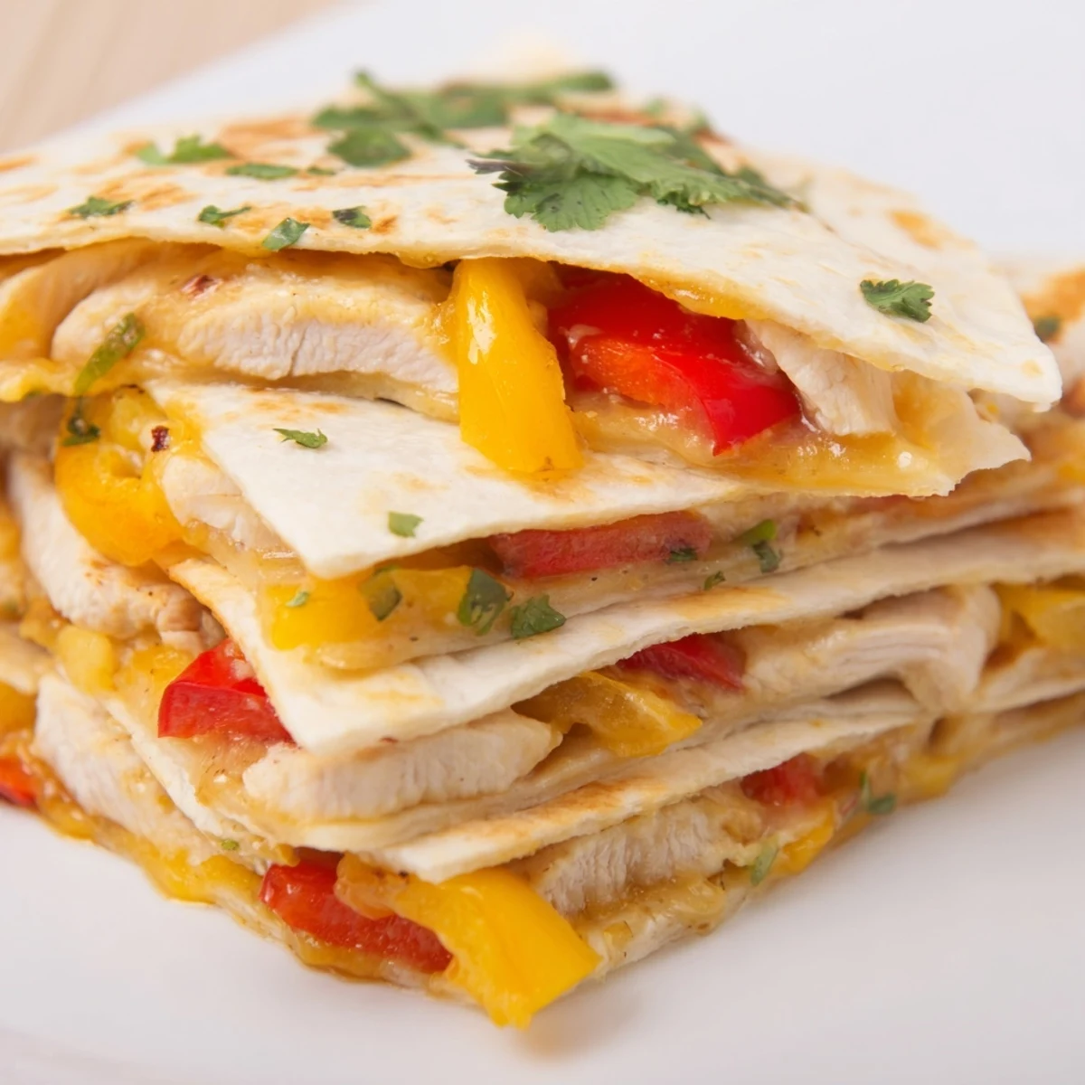 Golden crispy flour tortilla stuffed with seasoned chicken, sautéed peppers, and gooey melted cheese on a rustic plate.