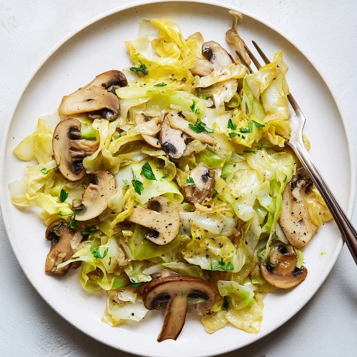 Tender cabbage and cremini mushrooms sautéed with thyme, served as a healthy European-style side. 