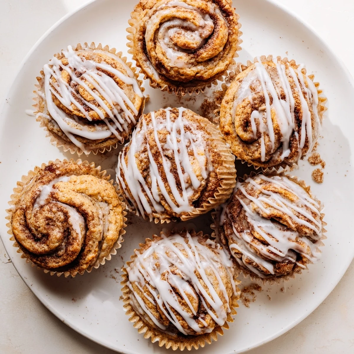 Fluffy high protein muffins with spiraled cinnamon sugar baked to golden brown perfection