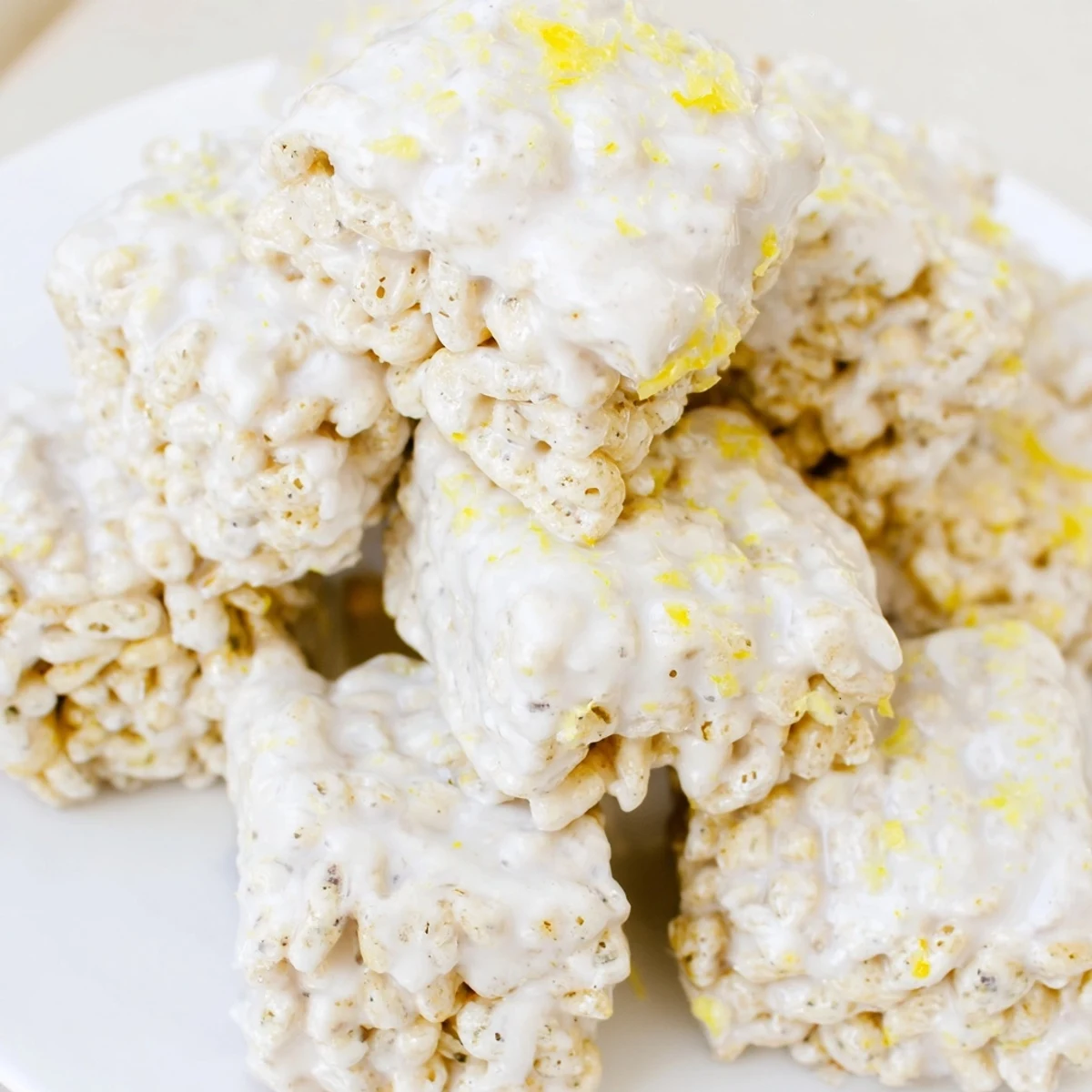 Citrusy lemonade puppy chow mix with white chocolate coating and lemon zest garnish