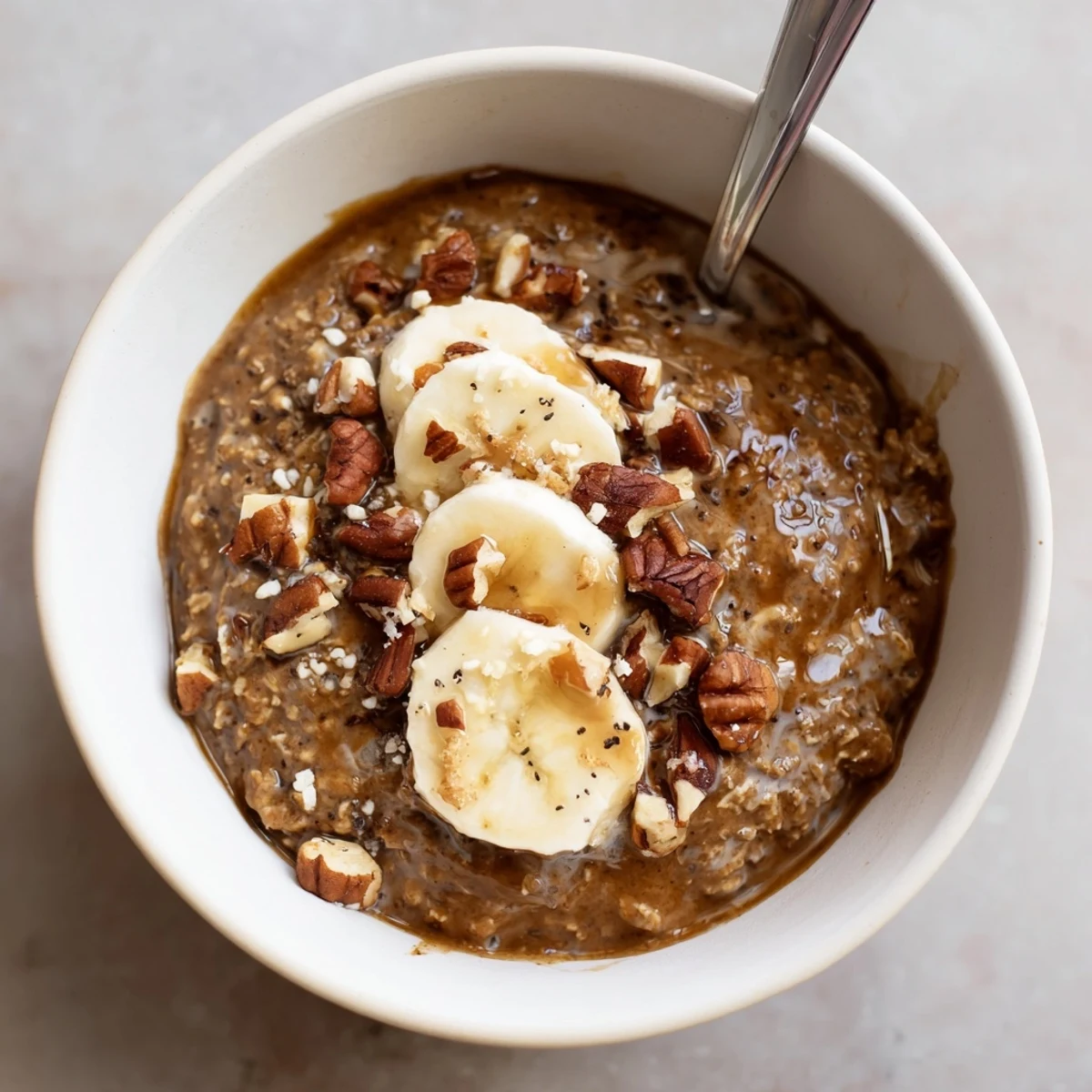Velvety Brown Sugar Coffee Overnight Oats fragrant with vanilla, drizzled maple syrup.