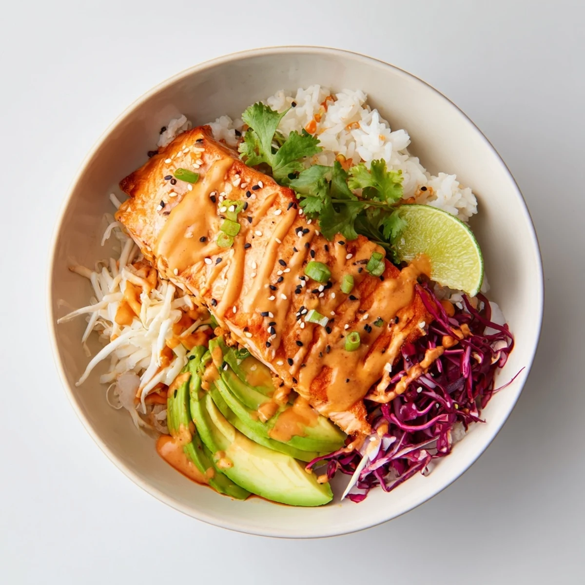 Colorful Bang Bang Salmon Bowls recipe: fluffy jasmine rice, avocado, sesame sprinkle