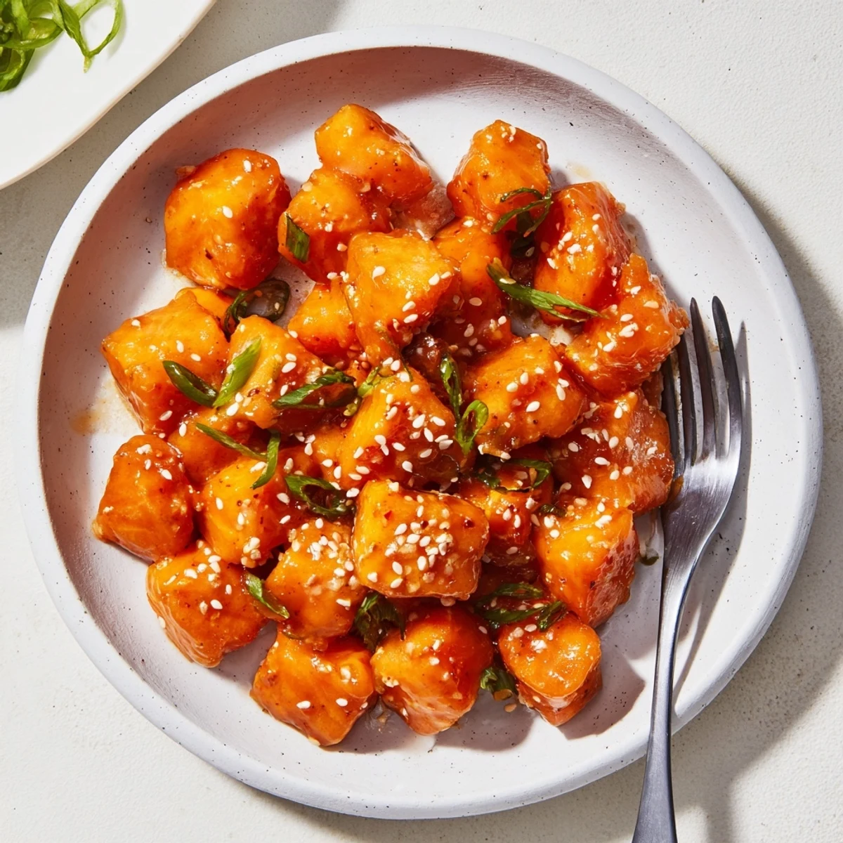 Sizzling Bang Bang Salmon Bites Recipe in skillet, crunchy exterior, steam rising