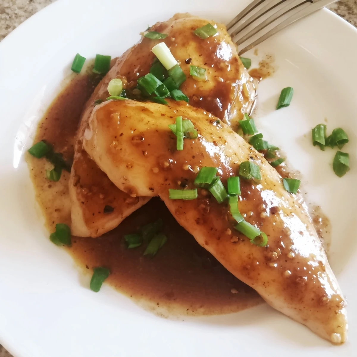 Slow Cooker Brown Sugar Garlic Chicken simmering in sticky sweet sauce, ready to serve