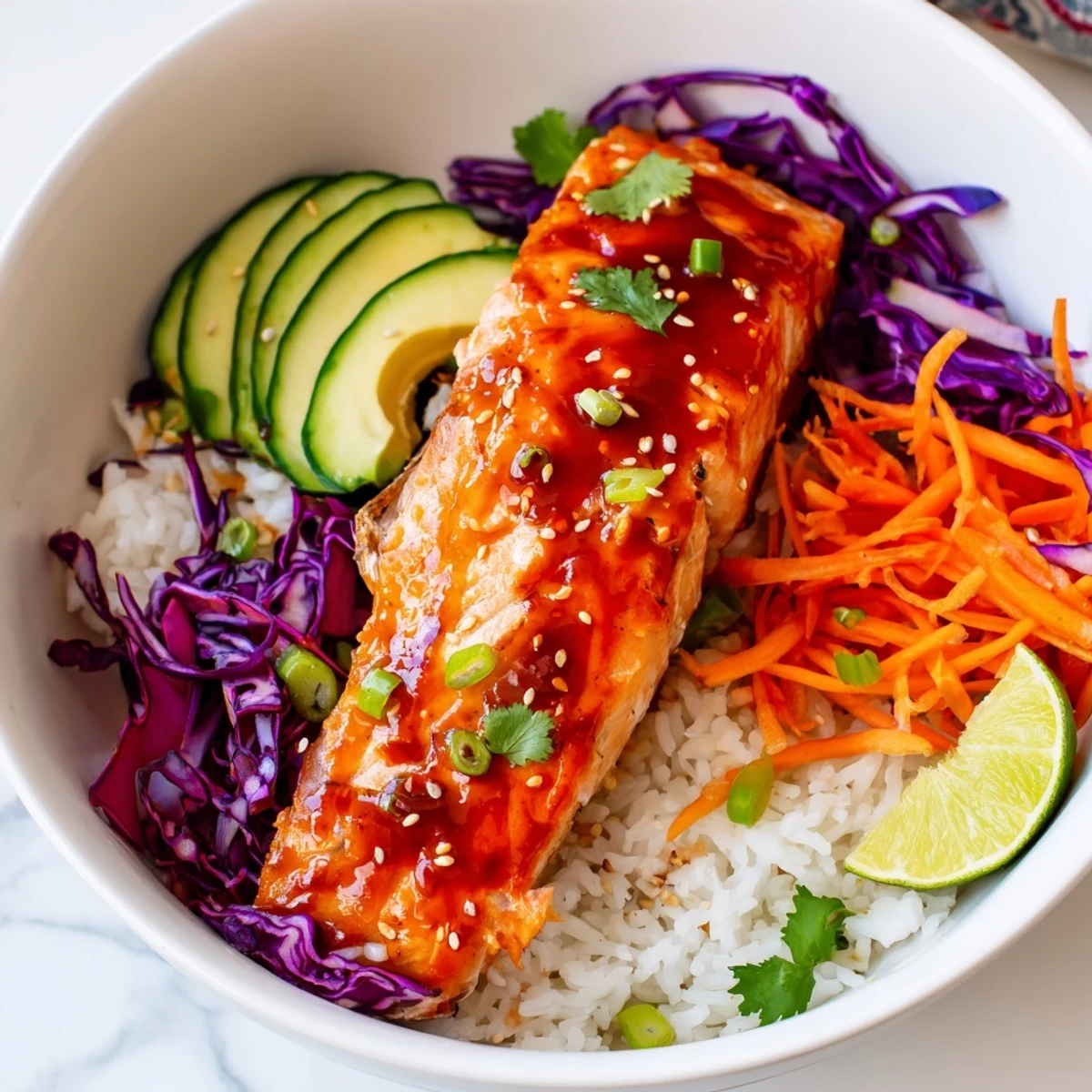 Golden sriracha honey glazed salmon bowls served over fluffy jasmine rice